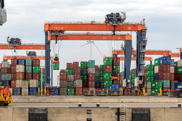 Containers and gantry cranes in the Port of Rotterdam. ROTTERDAM, THE NETHERLANDS - AUG 23, 2017.