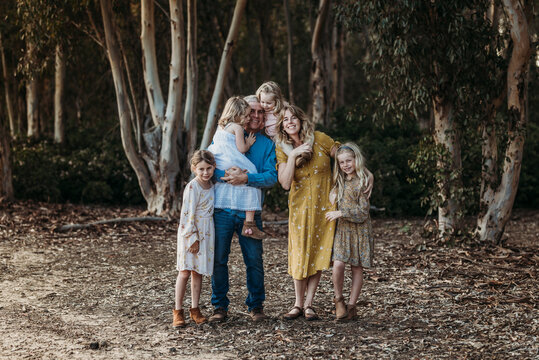 Portrait of Large Extended Family Embracing Outside