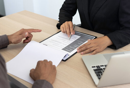 Male job applicants are explaining in detail their work history and Talent to job interviewers written on resume, job interview inquiry ideas.
