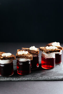 berry tinctures in shorts on black background