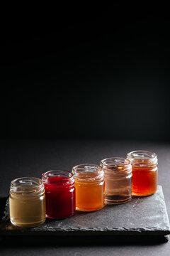 berry tinctures in shorts on black background