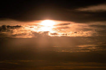 Dramatic orange sunlight photo during sunset period with cloudy sky environment. Abstract background from natural photo.