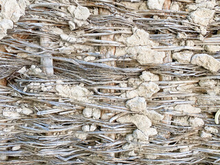 Detail of the wall of a traditional farmhouse in Turkey, made of wood, loam and straw