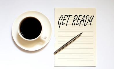 GET READY - white paper with pen and coffee on white background