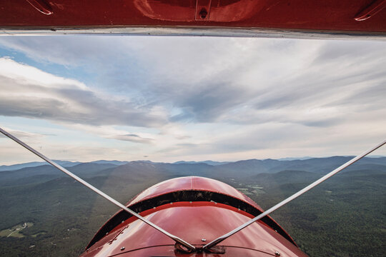View from cockpit of vintage biplane of White Mountains, New Hampshire