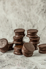 Homemade chocolate alfajores, typical of Argentina, marble background with copy space