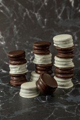 Homemade chocolate alfajores, typical of Argentina, marble background with copy space