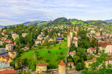 Fototapeta na wymiar Aerial view of Lucerne city walls on green hills. Canton of Lucerne, Switzerland.
