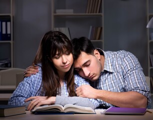 Two students studying late at night