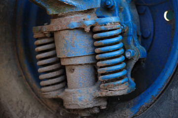 old vintage shock absorbers of the tractor close-up