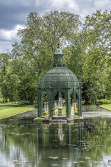 Fototapeta na wymiar Antique gazebo in English Garden (Jardin Anglais, 1817). Chantilly, Oise, Picardie, France.