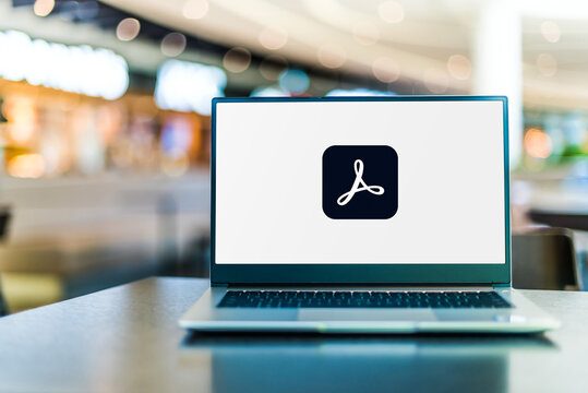 Laptop computer displaying logo of Adobe Acrobat