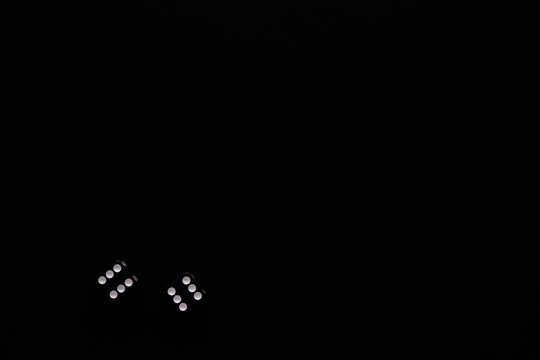 dice on a black background