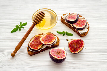 Canape or sandwich with figs and cheese, overhead view
