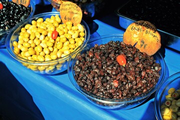 Stall with Greek olives at street market, May 18 2019.