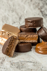Homemade chocolate alfajores, typical of Argentina, marble background with copy space