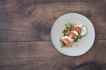Caprese Salad on a Wooden Table