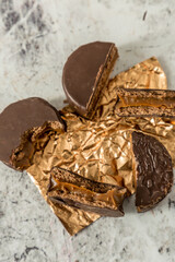 Homemade chocolate alfajores, typical of Argentina, marble background with copy space
