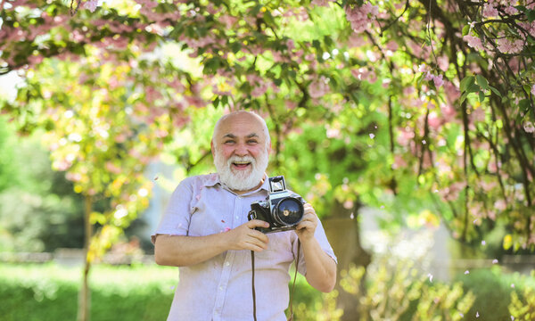 Vintage Camera. Retro Camera. Senior Man Holding Professional Camera. Photography Courses. Become Photographer. Education For Elderly. Grandfather Hobby. Images That Tell Story. Power Behind Picture