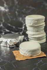 Homemade chocolate alfajores, typical of Argentina, marble background with copy space