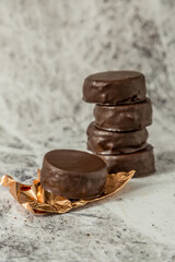 Homemade chocolate alfajores, typical of Argentina, marble background with copy space