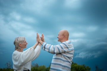 Fototapeta premium happy senior couple have romantic dating and dancing outdoor at summer