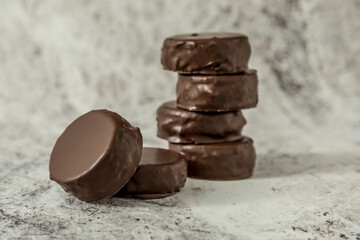 Homemade chocolate alfajores, typical of Argentina, marble background with copy space