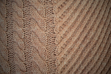 Knitted woolen beige fabric close up