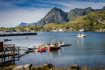 Fototapeta premium fishing boats near the pier. Fisherman's house. Norway, fishing on the islands in the Arctic Circle