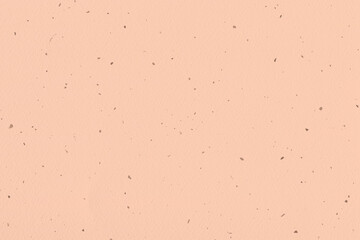 Pink earthy blush texture. Peachy handcrafted background with dots and flakes.