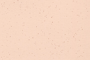 Pink earthy blush texture. Peachy handcrafted background with dots and flakes.