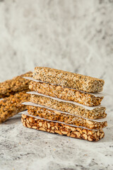 Super food breakfast Granola bars with Oats, Almonds, Pumpkin seeds, Flax seeds, Honey and Dates. flat lay on textured background with ingredients. with copy space.