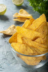 Corn chips in a glass Cup on the table. Mexican food. Nachos in a glass Cup.
