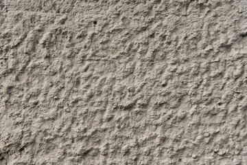 The texture of a gray bumpy decorative wall.