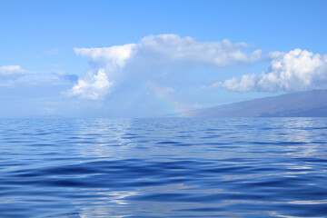 Rainbow over Pacific Ocean by Lahaina island.