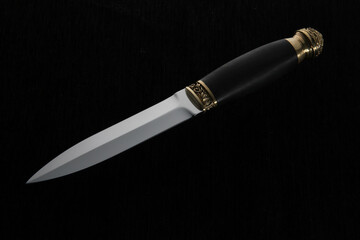 knife with black handle on black background