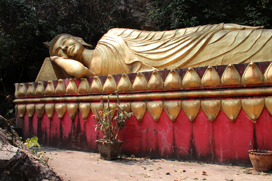statue of a lying buddha in luang prabang (laos)