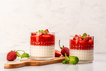 Traditional Italian dessert panna cotta with strawberry jelly. Summer yogurt dessert. catering, banner, menu, recipe, place for text