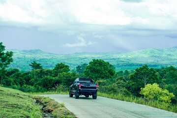 Travelling on green mountain road with raining, Holiday activity, Beautiful landscape mountain in Thailand