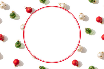 Christmas background. Christmas balls, red, green and gold on white background. Flat lay, top view, copy space. Greeting card, package, invitation trendy christmas new year design.