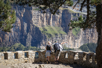 Scenic viewpoint over Ordesa Valley with turists on it. Ordesa y Monte Perdido National Park....