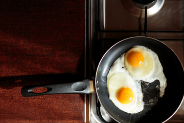 making english breakfast. cooking scrambled eggs.