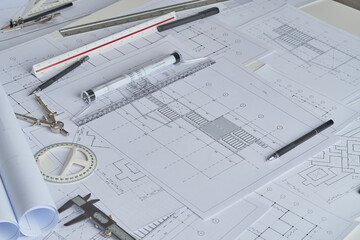 Architect engineer contractor design working drawing sketch plan blueprint and making architectural construction house building in architect studio.