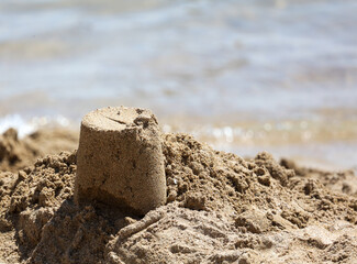 Fototapeta na wymiar Sand building on the beach