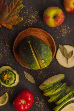 Top view of fresh vegetables and fruits that lie on a black background