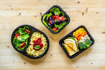 Food delivery background. Take away meal in boxes. Top view