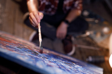 Obraz premium Moving paint brush artist works on abstract oil painting in creative modern studio. Abstract Modern Art.