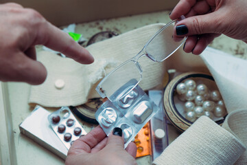 People checking expiry date of pills