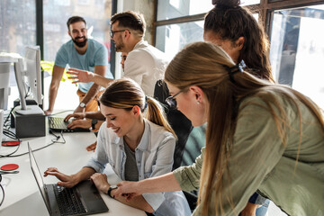 Fototapeta premium Group of female designers and programmers starting a new project at the office. 