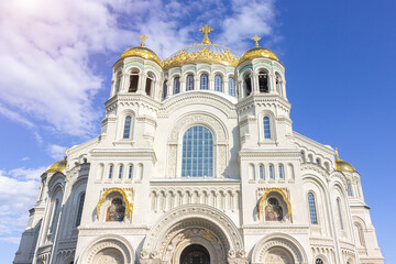 Fototapeta premium Kronshtadt, Saint Petersburg, Russia,09.08.2020. The Cathedral of St. Nicholas the Wonderworker. Blue sky, clouds and sunny weather. important religious site.